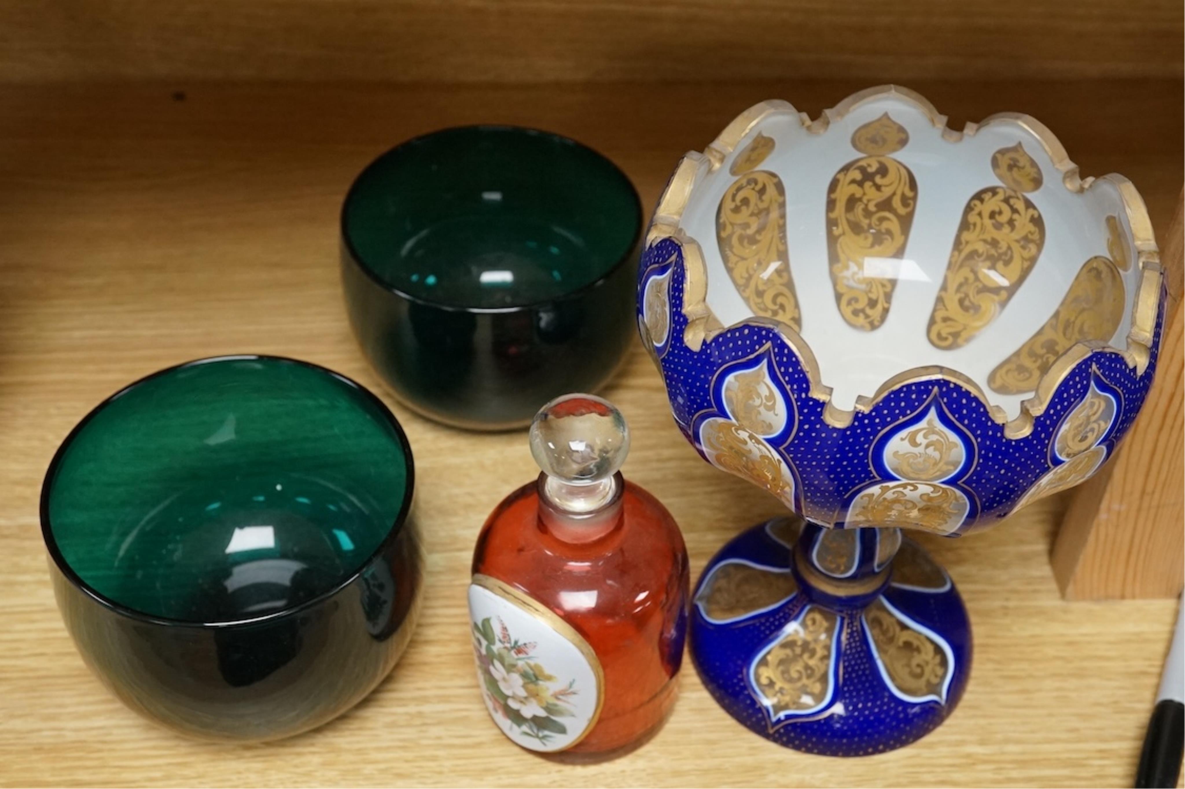 A pair of 19th century green glass fingerbowls, a Bohemian blue overlaid glass vase and a ruby glass scent bottle, largest 20cm high